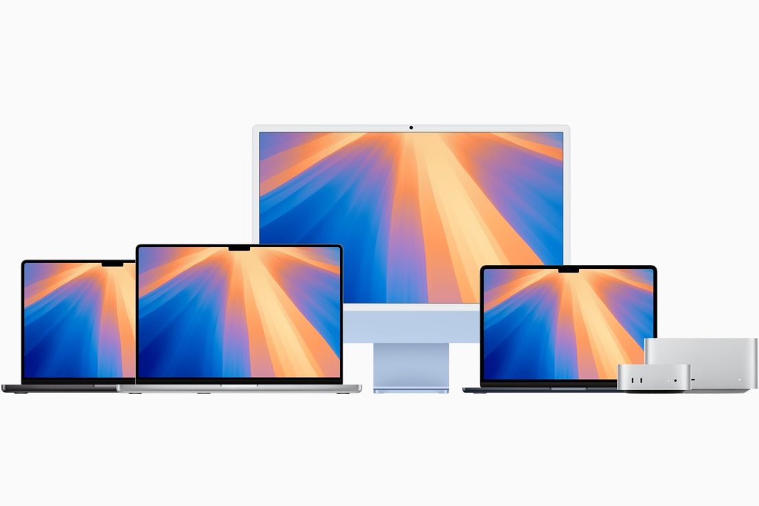 Une gamme de Mac Apple sur fond gris.